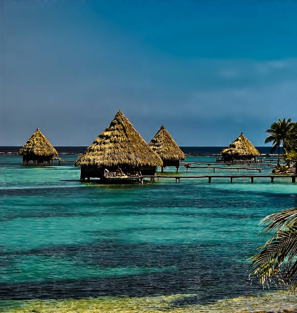 Cabanas/Bungalows built over ocean shallows of the beaches of Glover's Atoll, Belize