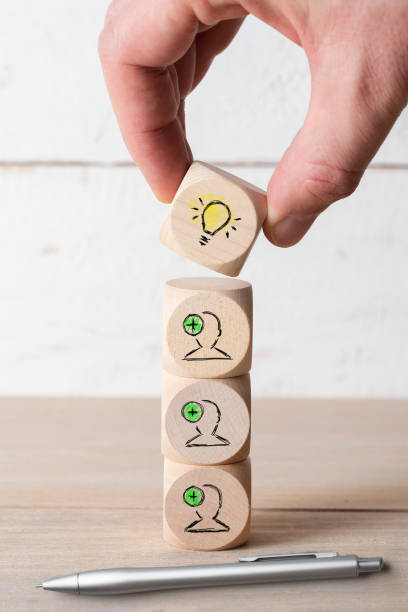 istock many people together having an idea symbolized by icons on cubes 1096259622