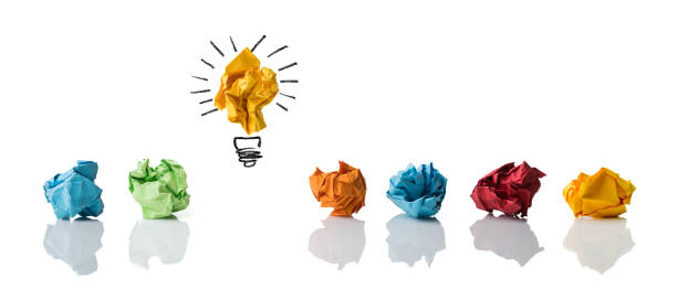 istock crumpled paper symbolizing different solutions with one highlighted as a light bulb as the right one isolated on white 1096262906