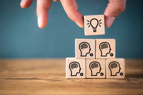 istock many people together having an idea symbolized by icons on cubes 1096263308