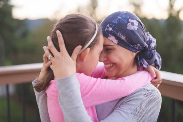istock Mother with cancer hugging her daughter 1096280086
