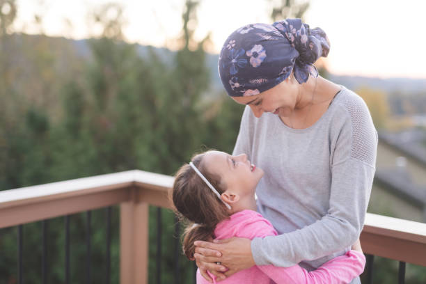 istock Mother with cancer hugging her daughter 1096280088