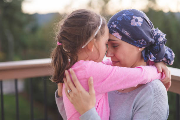 istock Mother with cancer hugging her daughter 1096280090