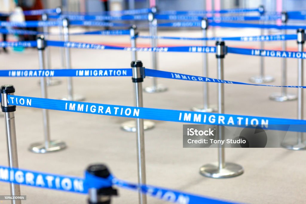 immigration board line Emigration and Immigration Stock Photo