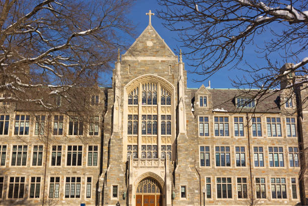 istock White-Gravenor Hall of Georgetown University in winter with snow of tree branches. 1096325236