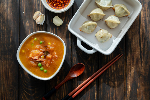 Chinese food: fried Jiaozi and tomato soup
