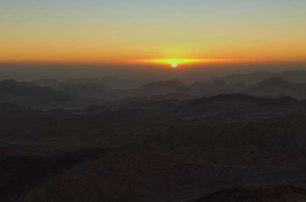 istock Mysterious golden sunrise in the mountains. White sun disk on the mountains. View from Mount Sinai (Mount Horeb, Gabal Musa, Moses Mount). Sinai Peninsula of Egypt 1096334536