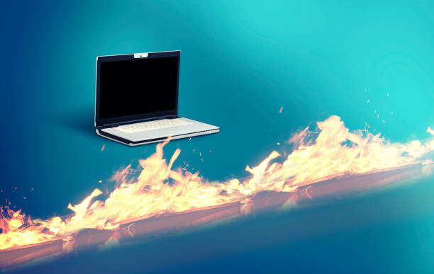 istock Laptop in front of a firewall suggesting cyber protection. 1096346016