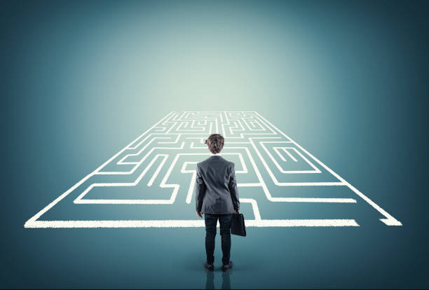 istock Businessman stands in front of a maze . 1096346054