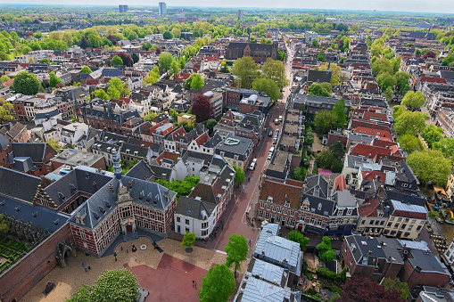 Arial view from the top of the tower of the St. Martins Cathedral at sunny day. Beautiful view of streets with ancient buildings of Utrecht. Popular travel destination in the Netherlands