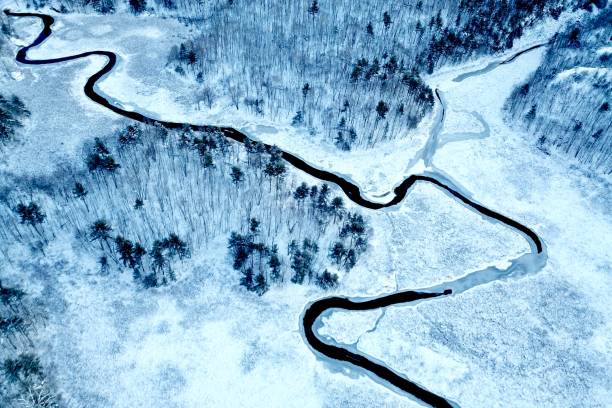 istock Aerial view of winding river and snow 1096378778