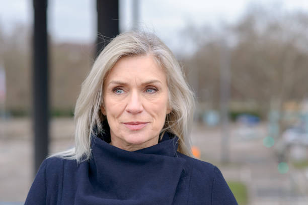 istock Pensive woman scrutinising the camera 1096380362