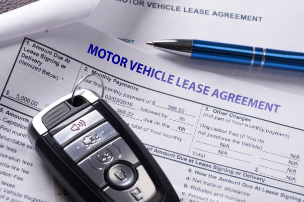 istock Automobile lease agreement document with key and pen on contract 1096380366