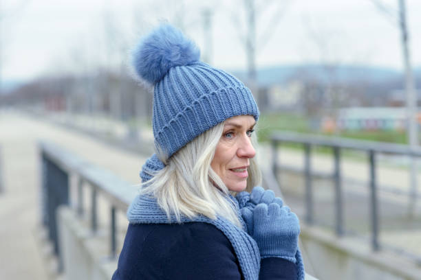 istock Pretty blond woman standing on a walkway 1096380506