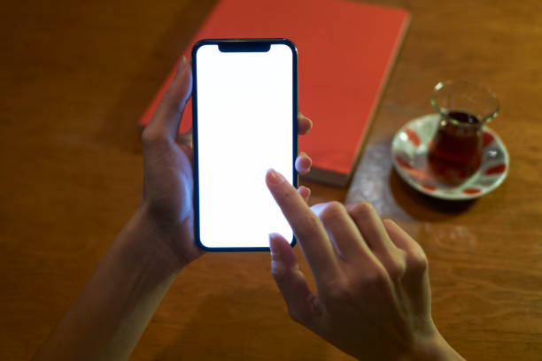 istock Woman Using Smart Phone With White Screen in Cafe 1096383588