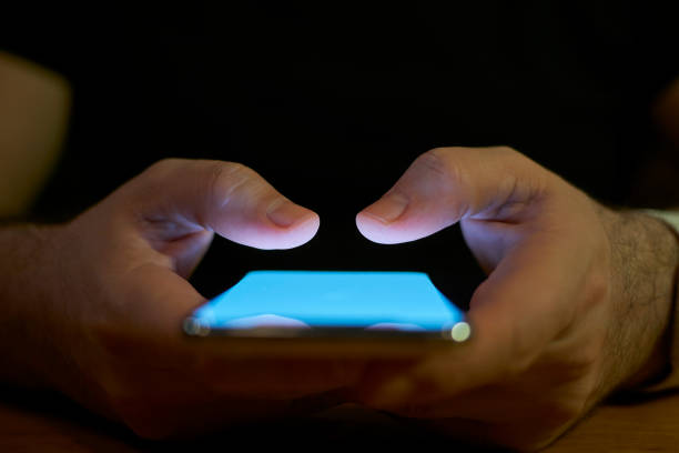 Young Men Using Smart Phone Social Media Concept