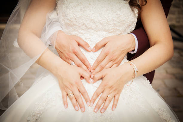 istock Hands newlyweds with wedding rings close up 1096391068