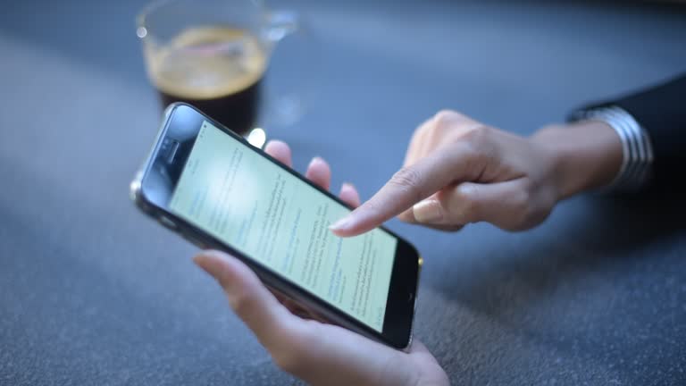 Close up women using phone in office