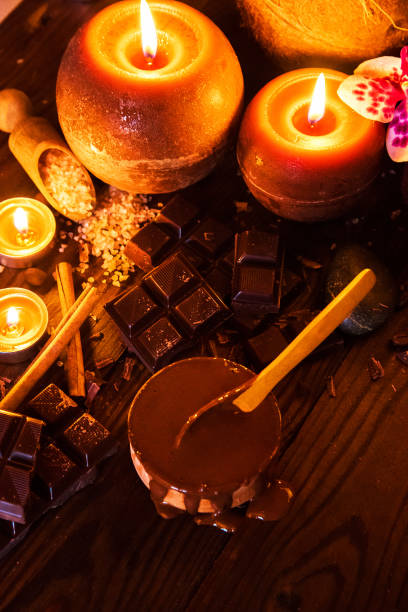 istock Spa concept with chocolate and candles on a wooden background. 1096412848