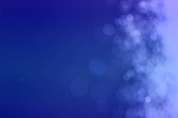 istock blue glossy light one side frame bokeh texture - fantastic abstract photo background 1096415972