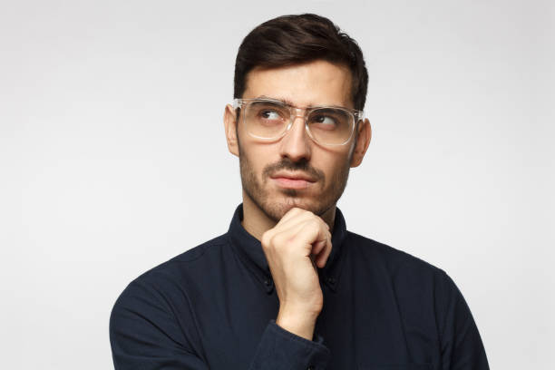 istock Pensive thoughtful business man isolated on gray background 1096419430