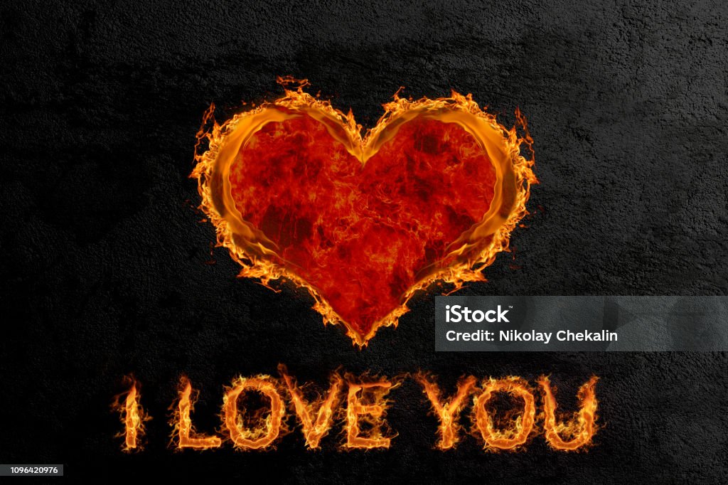 Fiery heart on the background of a concrete wall Heart of fire with an inscription of love confession on the background of a concrete wall Flame stock illustration