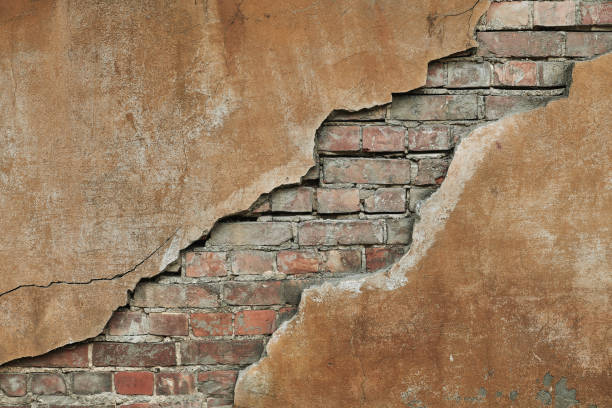 istock Cracked concrete vintage brick wall 1096424426