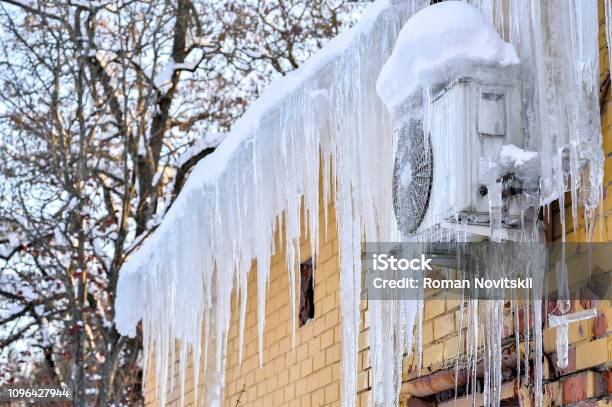 The Back Of The Building Is Airconditioned Cafe On The Wall Covered With A Thick Layer Of Icicles Stock Photo - Download Image Now