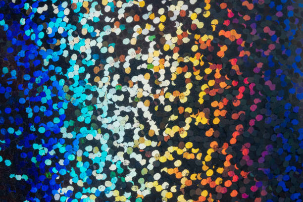 Closeup of a hologram glitter showing tiny reflective dots