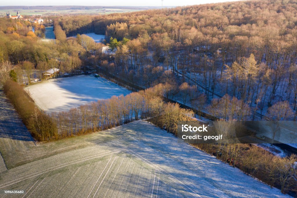 Aerial view of a football field of a district league team in a village with the first snow of the year Aerial view of a football field of a district league team in a village with the first snow of the year, drone shot Accessibility Stock Photo