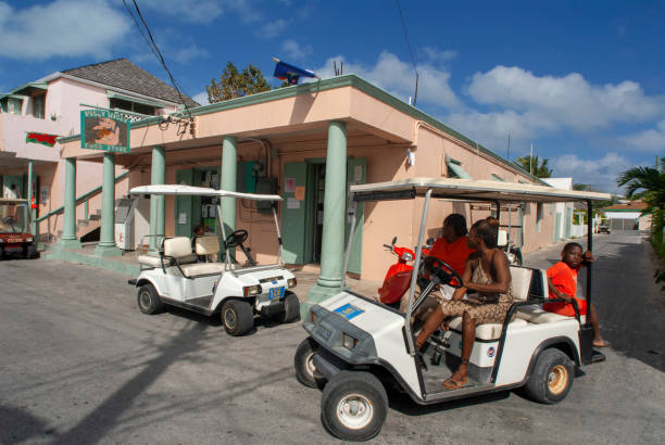 Bahamas Golf car and loyalist home. Bay Street. Dunmore Town, Harbour Island, Eleuthera. Bahamas dunmore town stock pictures, royalty-free photos & images