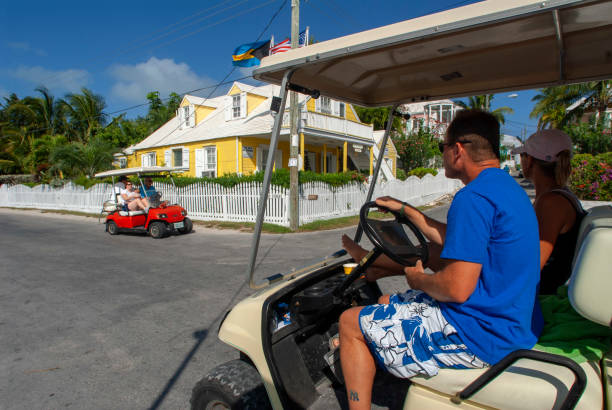 Bahamas Golf car and loyalist home. Bay Street. Dunmore Town, Harbour Island, Eleuthera. Bahamas dunmore town stock pictures, royalty-free photos & images