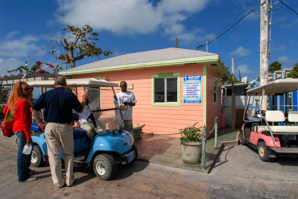 Bahamas Rental Golf car and loyalist home. Bay Street. Dunmore Town, Harbour Island, Eleuthera. Bahamas dunmore town stock pictures, royalty-free photos & images