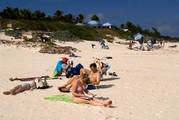 Bahamas Tourists at Pink Sand Beach. Dunmore Town, Harbour Island, Eleuthera. Bahamas dunmore town stock pictures, royalty-free photos & images