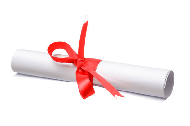 istock Paper scroll diploma tied with red ribbon isolated on a white background 1096446164