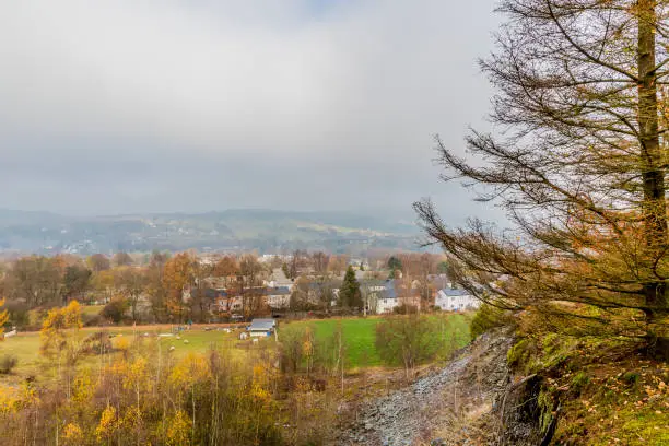 beautiful image a part of the village of Vielsalm view from the hill Bec du Corbeau with a gray and cloudy sky on an autumn day in of the Belgian Ardennes