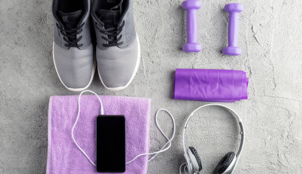 istock Fitness accessory composition. Sneakers, smartphone and headphones, dumbbell 1096451982
