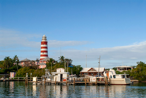 Hope Town lighthouse, Elbow Cay, Abacos. Bahamas. Lighthouse and harbor in the tiny village of Hope Town.