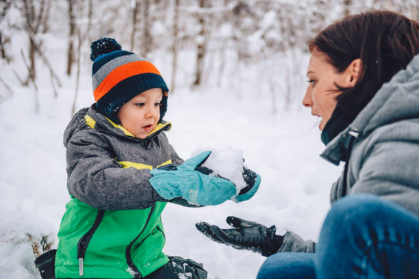 istock Mother and son playing in the snow 1096452852