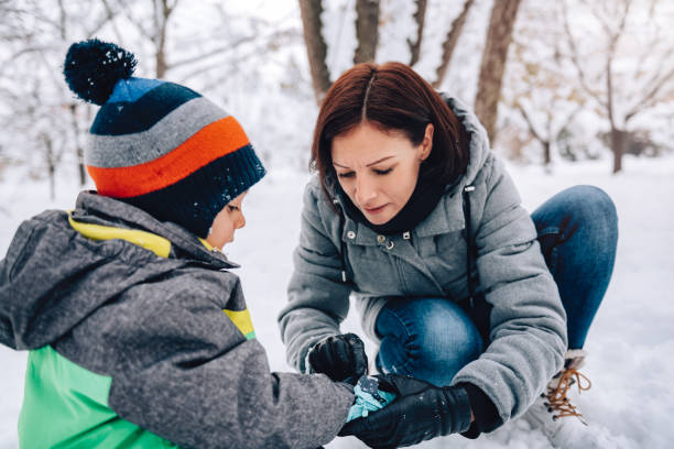istock Mother and son playing in the snow 1096452898