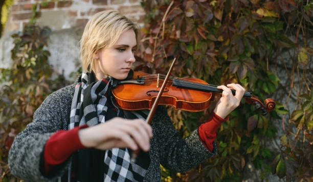 istock Girl plays a old violin. 1096458740