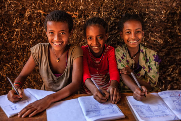 istock African children during the class, East Africa 1096482464