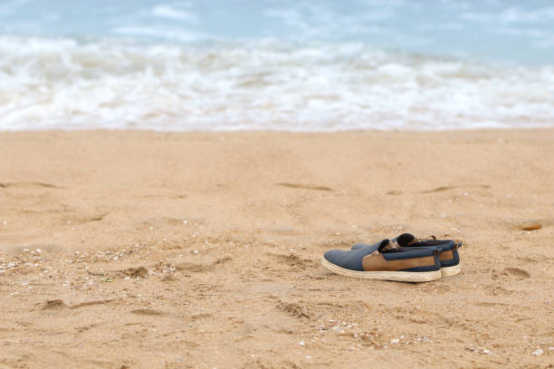 istock Indian made vintage shoes isolated on beach 1096486842