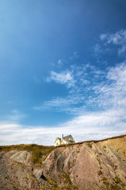 istock Yellow house on clifftop 1096488876