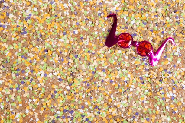 Party blowers on a slightly reflective surface with confetti and ribbon.PLEASE CLICK ON THE IMAGE BELOW TO SEE OTHER PARTY & CELEBRATION IMAGES IN MY PORTFOLIO: