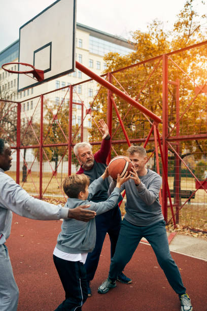istock Three generations Playing Basketball Outdoors 1096491268