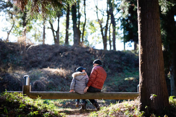 istock Father and daughter playing in the forest 1096491854
