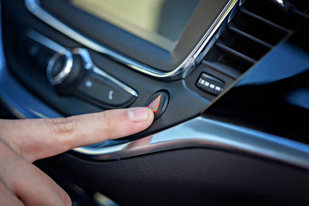 istock Man hand pushing car buttons. Parking light. 1096493378