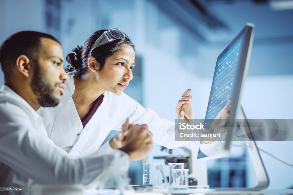 Scientists Working in The Laboratory Scientist Working in The Laboratory Laboratory Stock Photo