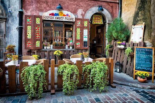 Warsaw, Poland - September 20, 2018:Entrance to traditional Polish flowers restaurant. Restaurant located in the historic center of Warsaw's Old Town in Waski Dunaj street
